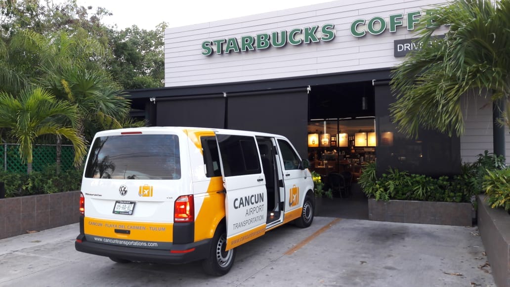 VW Transporter van for Private Transfer parked at a coffee shop