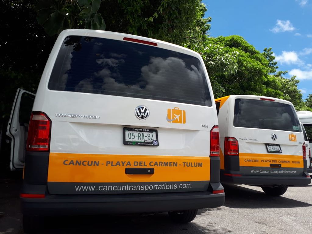 Back side of two Private Transfer vans