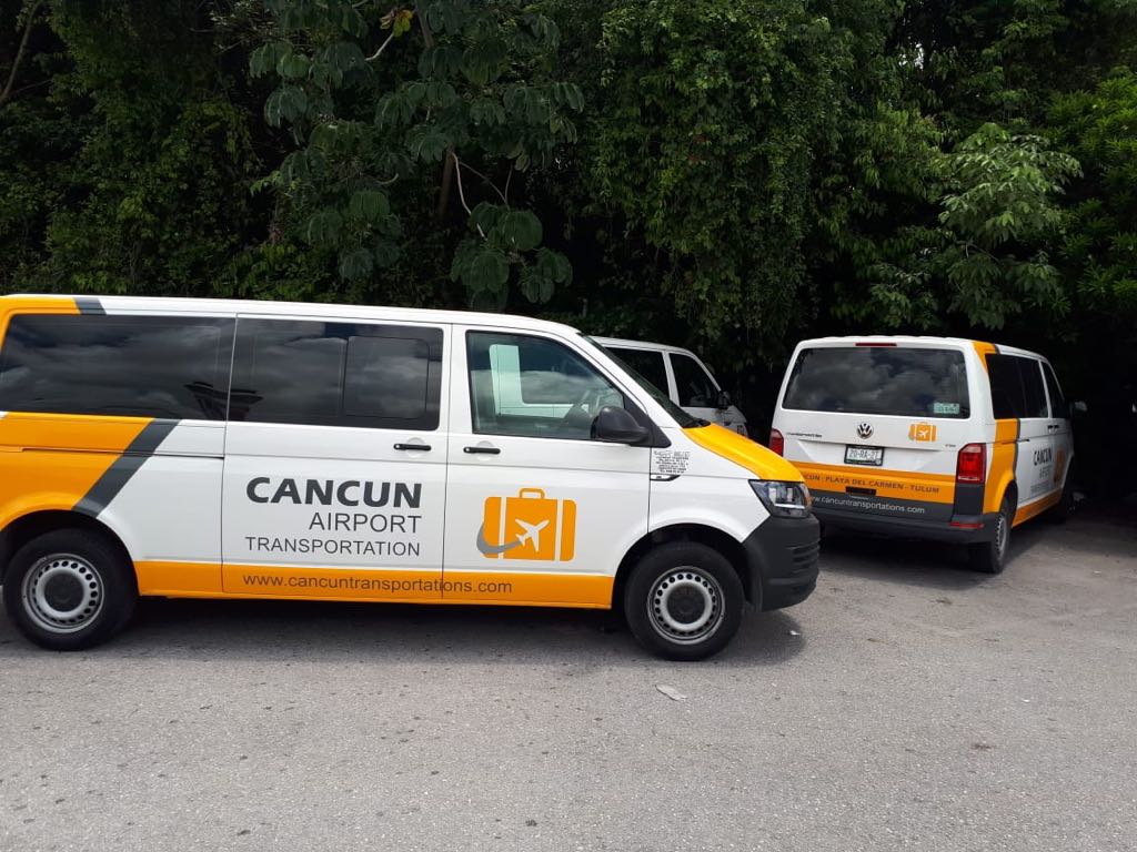 Three Private Transfer vans parked together